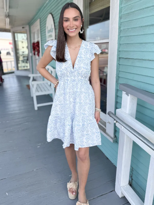 Mini dresses with criss - cross backs for a flirty look The Robin Floral Ruffle Dress-Blue