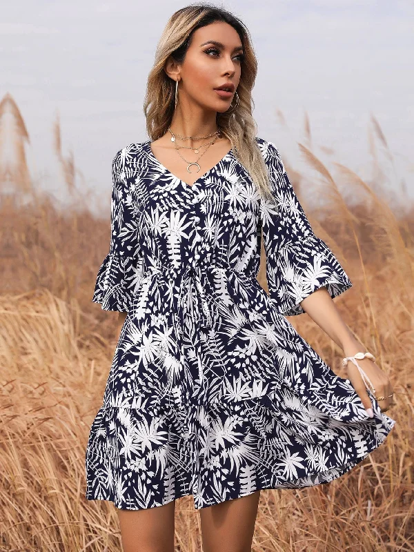 Midi dresses with asymmetric hems for a fashion - forward and dynamic appearance KittenAlarm - Ditsy floral print V neck Flutter Sleeve Belted Dress
