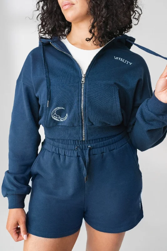 Women's hoodie with a kangaroo pocket and a pom - pom drawstring for added charmThe Mantra Zip - Navy - Moon Women's hoodie with a kangaroo pocket and a pom - pom drawstring for added charmThe Mantra Zip - Navy - Moon